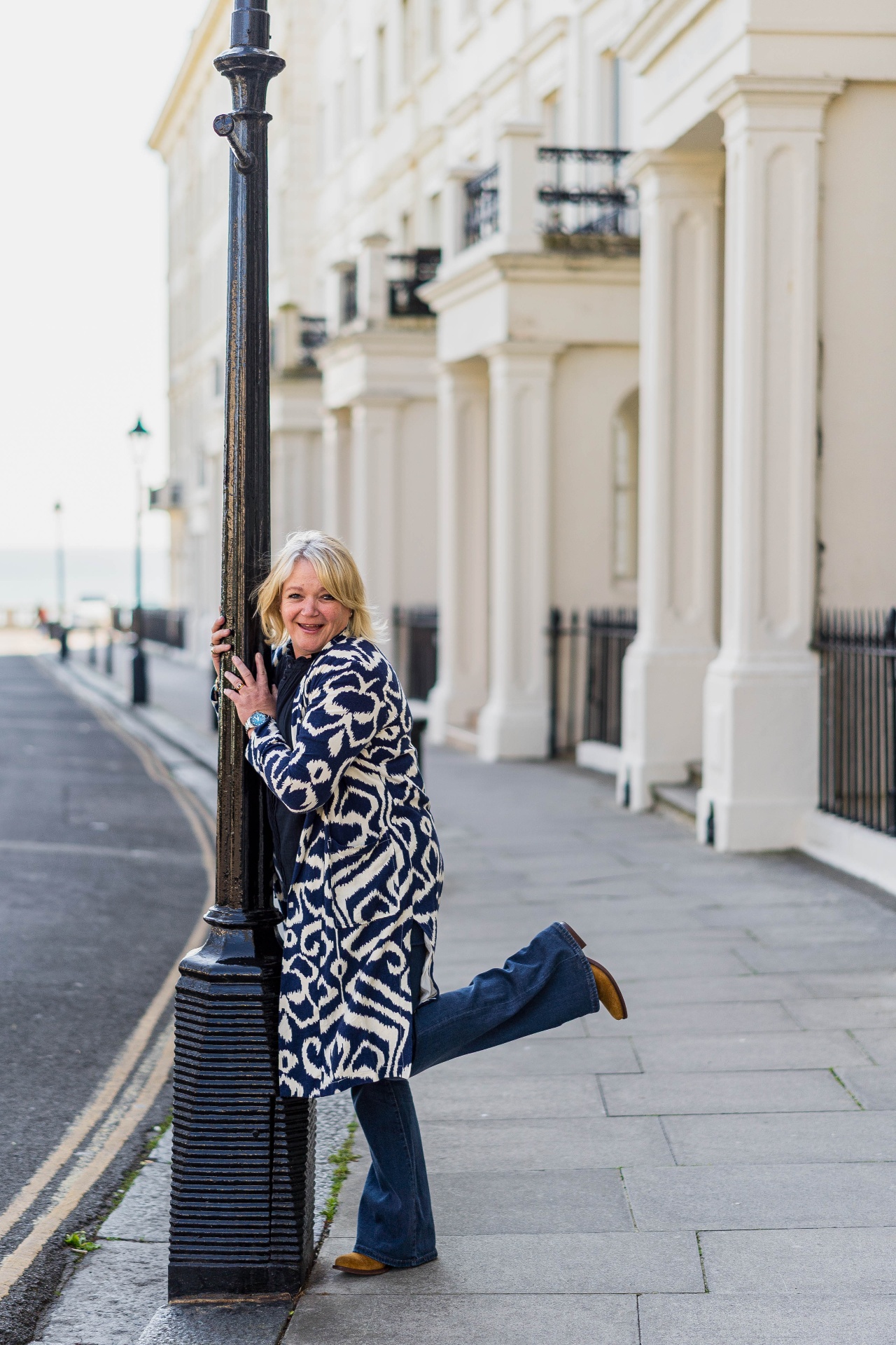 Charlie on a Brighton street beside a Victorian lamppost